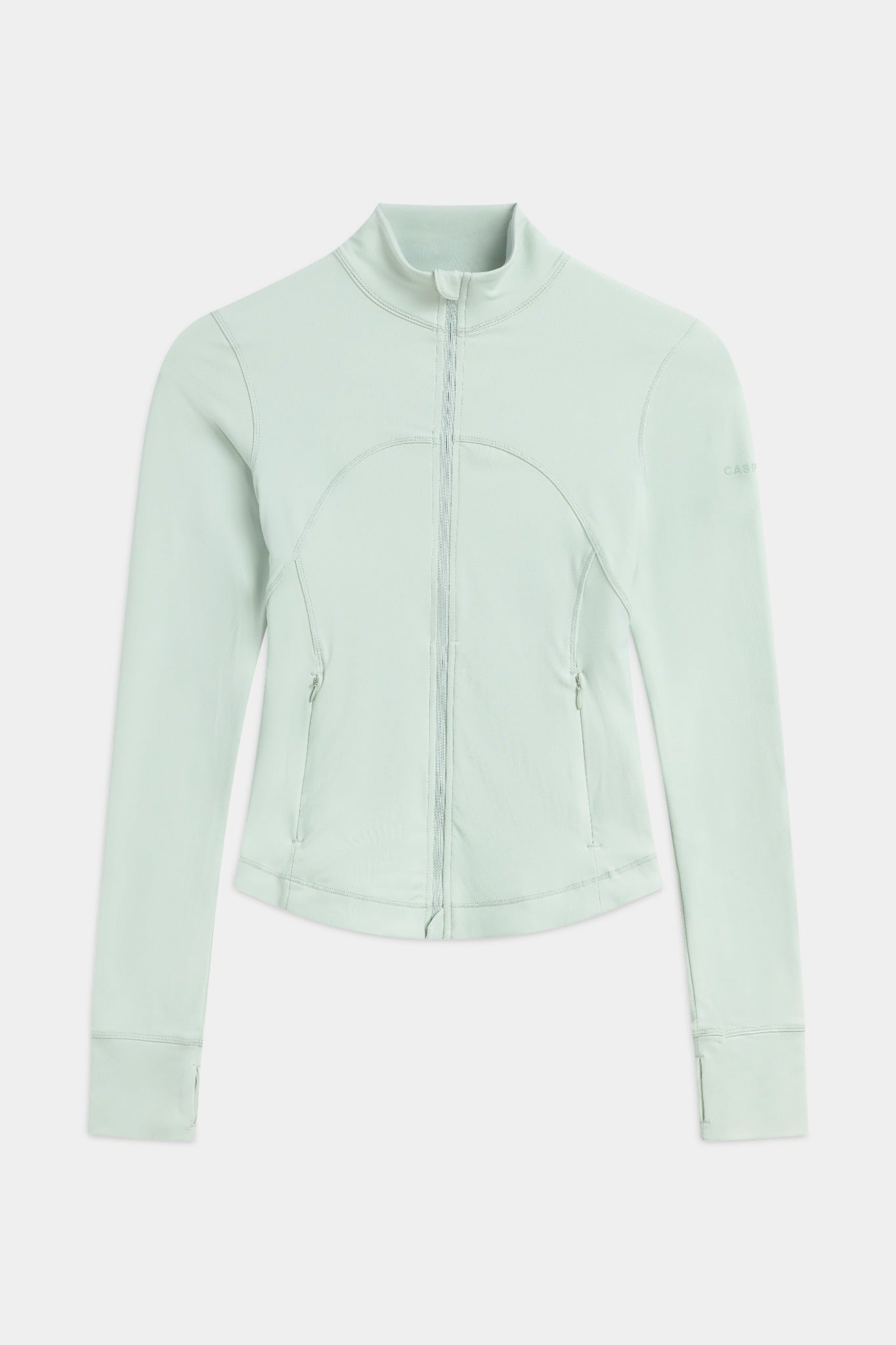 Front view of the pistachio green CASPARA Sculptluxe zip jacket on a neutral background.
